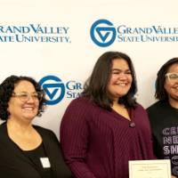 Group of three women - one with a certificate